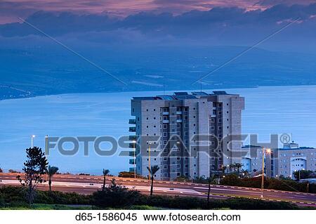 Stock Photography - Israel, The Galilee, Tiberias, elevated town view and of Sea of Galilee-Lake Tiberias, dawn. Fotosearch