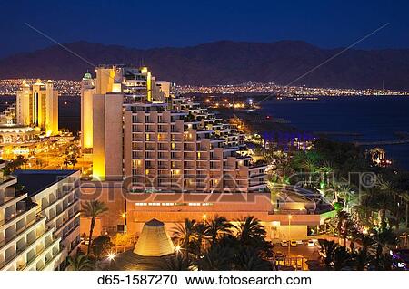 Israel, The Negev, Eilat, Red Sea beachfront, elevated resort view, evening View Large Photo Image Stock Image - Israel, The Negev, Eilat, Red Sea beachfront, elevated resort view, evening. Fotosearch