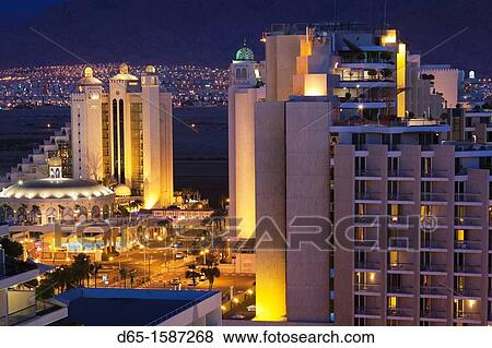 Stock Photo - Israel, The Negev, Eilat, Red Sea beachfront, elevated resort view, evening. Fotosearch