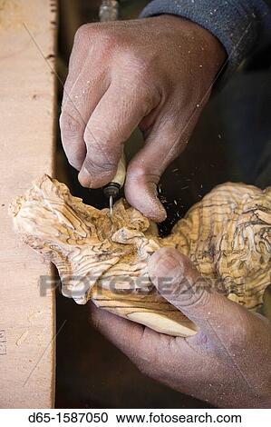 Stock Image - Israel, West Bank, Bethlehem, Arab Christian artisan making wooden religious figures, R, MR-ISL-11-003. Fotosearch