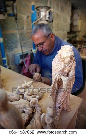 Israel, West Bank, Bethlehem, Arab Christian artisan making wooden religious figures, R, MR-ISL-11-003 View Large Photo Image Stock Image - Israel, West Bank, Bethlehem, Arab Christian artisan making wooden religious figures, R, MR-ISL-11-003. Fotosearch