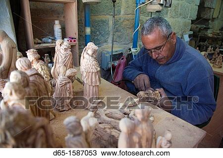 Israel, West Bank, Bethlehem, Arab Christian artisan making wooden religious figures, R, MR-ISL-11-003 View Large Photo Image Stock Image - Israel, West Bank, Bethlehem, Arab Christian artisan making wooden religious figures, R, MR-ISL-11-003. Fotosearch