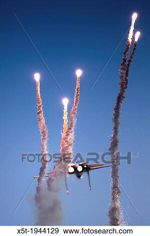 Israeli Air force F-15I Fighter in flight Emitting anti-missile flares. View Large Photo Image Stock Photo - Israeli Air force F-15I Fighter in flight Emitting anti-missile flares.. Fotosearch