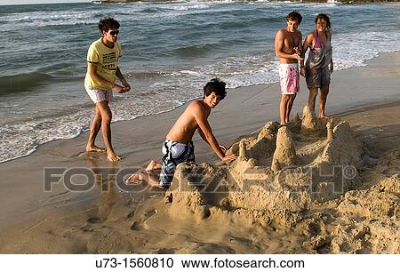 Israeli teenagers playing on the beach in Tel Aviv. View Large Photo Image Stock Image - Israeli teenagers playing on the beach in Tel Aviv.. Fotosearch