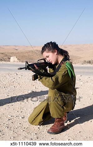 Israeli young female soldier in uniform aiming her M16 rifle View Large Photo Image Stock Photo - Israeli young female soldier in uniform aiming her M16 rifle. Fotosearch