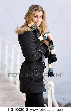 It is cold outside, attractive young woman with a scarf View Large Photo Image Stock Photo - It is cold outside, attractive young woman with a scarf. Fotosearch