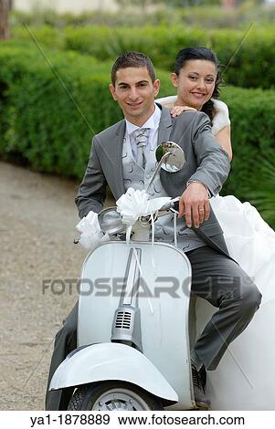 Italian wedding couple on a motor scooter Vespa, Firenze, Tuscany, Italy View Large Photo Image Stock Photo - Italian wedding couple on a motor scooter Vespa, Firenze, Tuscany, Italy. Fotosearch