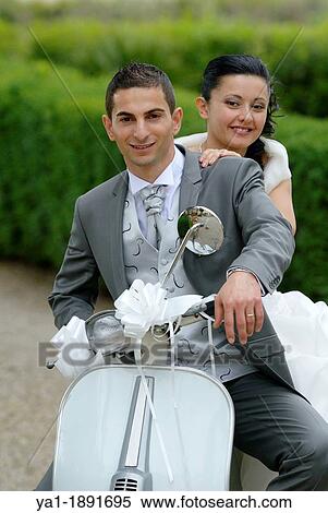 Italian wedding couple on a motor scooter Vespa, Firenze, Tuscany, Italy View Large Photo Image Stock Photography - Italian wedding couple on a motor scooter Vespa, Firenze, Tuscany, Italy. Fotosearch