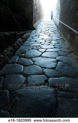 Stock Photo - Italy, Campania, Pompeii Stone roadway entering the city Roman city destroyed by eruption of Mount Vesuvius in AD 79. Fotosearch