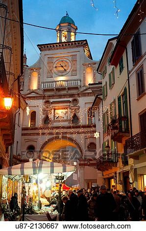 Stock Photo - Italy, Lombardy, Crema, Santa Lucia Feast, Market background Torrazo Tower City Gate.. Fotosearch