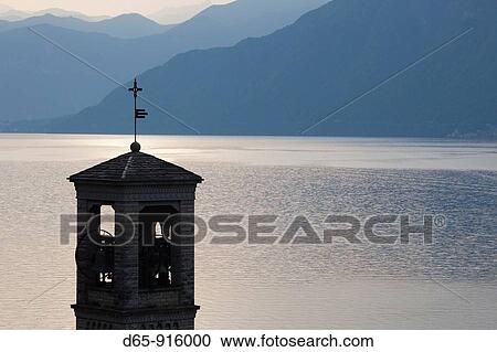 Italy, Lombardy, Lakes Region, Lake Como, Argegno, lake view with town church View Large Photo Image Stock Image - Italy, Lombardy, Lakes Region, Lake Como, Argegno, lake view with town church. Fotosearch