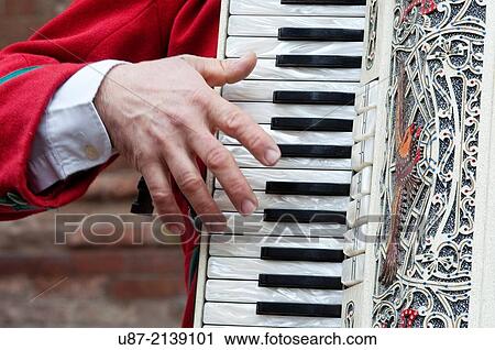 Stock Image - Italy, Lombardy, Man Playing Accordion.. Fotosearch