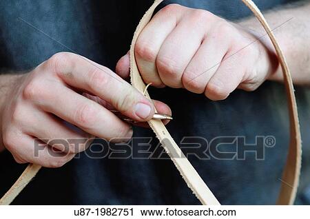 Stock Image - Italy, Lombardy, Reenactment Ancient Crafts, Leather Belt.. Fotosearch