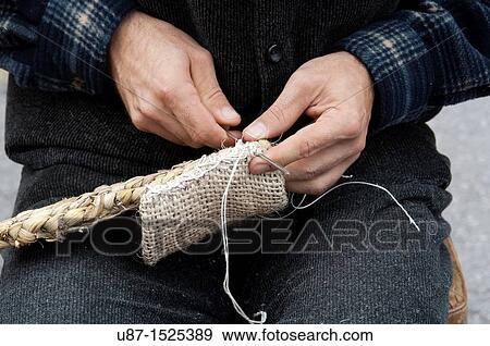 Stock Photo - Italy, Lombardy, Reenactment Ancient Crafts, Sewing Strip Shoe Sole With Corn Leaves. Fotosearch