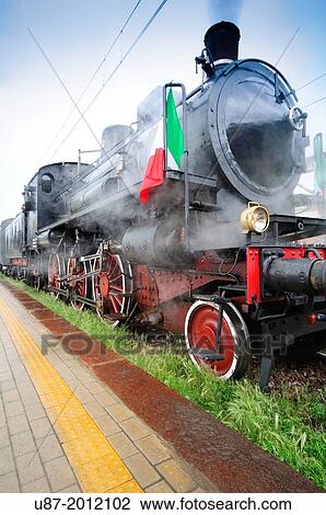 Stock Image - Italy, Lombardy, Vintage Steam Train.. Fotosearch