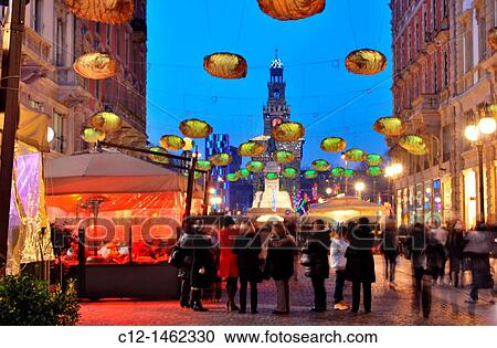 Stock Image - Italy, Milan, Christmas decorations, Castello Sforzesco in background. Fotosearch