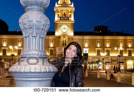 Italy, Parma, girl standing on Piazza Giuseppe Garibald in backgorund Palazzo del Governatore View Large Photo Image Stock Image - Italy, Parma, girl standing on Piazza Giuseppe Garibald in backgorund Palazzo del Governatore. Fotosearch