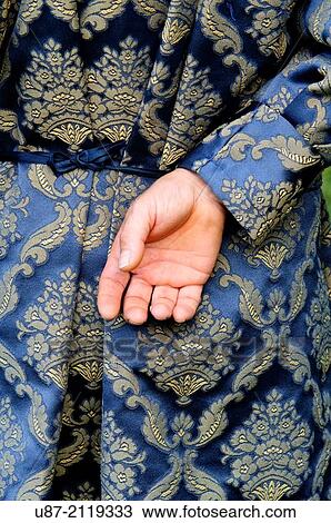 Stock Image - Italy, Piedmont, Historical Reenactment Mediaeval,, Man in Medieval Costume, Hands.. Fotosearch