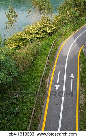 Stock Image - Italy, Trentino, Villa Lagarina, bicycle lane.. Fotosearch