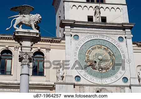 Stock Photo - Italy, Veneto, Padua, Piazza dei Signori Square, Column of the Winged Lion background Astronomical Clock.. Fotosearch