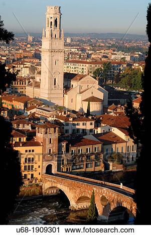 Stock Image - Italy, Veneto, Verona, Heritage listed old town UNESCO World, Ponte di Pietra bridge was built by the Romans in the first century after J-C to cross the river Adige. In the background, Verona Cathedral.. Fotosearch
