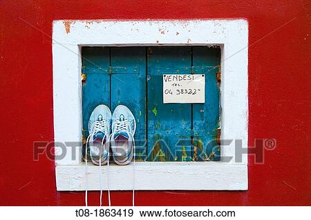 Stock Photo - Italy, Venice, Burano, window and shoes. Fotosearch