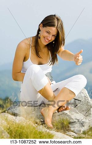It's OK - young woman dressed in White on the top of the mountain View Large Photo Image Stock Image - It's OK - young woman dressed in White on the top of the mountain. Fotosearch