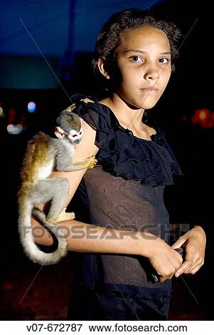 Jamaina Silva da Souza, in Jardim do Ouro, with her pet, a monkey that she found in the Amazonas riverside. Brazil. View Large Photo Image Stock Photo - Jamaina Silva da Souza, in Jardim do Ouro, with her pet, a monkey that she found in the Amazonas riverside. Brazil.. Fotosearch