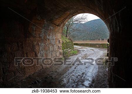 Jandula reservoir, tunnel excavated in the mountain of granite and slate in the reservoir of Jandula, Jaen, Spain View Large Photo Image Stock Image - Jandula reservoir, tunnel excavated in the mountain of granite and slate in the reservoir of Jandula, Jaen, Spain. Fotosearch
