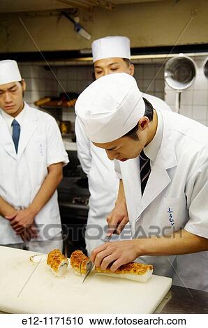Japan, Kyoto, Ryotei Nakamura, Bunji Nakamura actual chef with staff fixing sushis of hamo sea eel. View Large Photo Image Stock Image - Japan, Kyoto, Ryotei Nakamura, Bunji Nakamura actual chef with staff fixing sushis of hamo sea eel.. Fotosearch