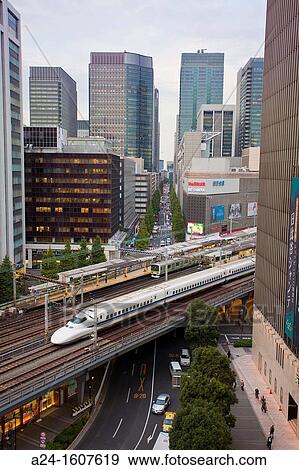 Stock Photo - Japan-Tokyo City-Ginza-The Bullet train through Yurakucho area. Fotosearch