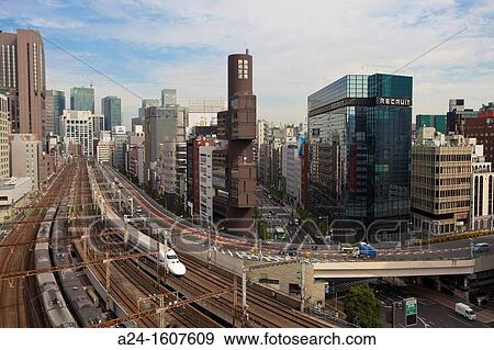 Stock Photo - Japan-Tokyo City-The Bullet Train through Ginza District. Fotosearch