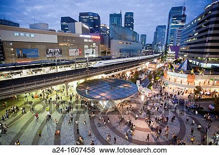 Stock Photo - Japan, Tokyo, the Bullet train trough Yurakucho Station. Fotosearch