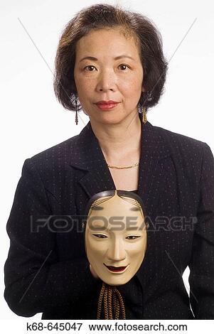 Japanese woman, late 50? s, with mask View Large Photo Image Stock Photo - Japanese woman, late 50? s, with mask. Fotosearch