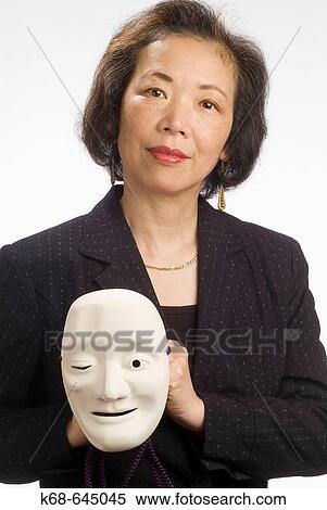 Japanese woman, late 50? s, with mask View Large Photo Image Stock Photography - Japanese woman, late 50? s, with mask. Fotosearch
