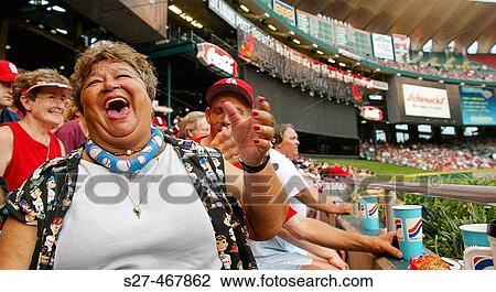 Jeanie Marie Carrino, AKA? Tidbits? is a 47 year old waitress/bartender who is the ultimate bleacher bum. She bakes cookies for the visiting players, yaks it up with players in the bullpen and attends nearly all home games. View Large Photo Image Stock Image - Jeanie Marie Carrino, AKA? Tidbits? is a 47 year old waitress/bartender who is the ultimate bleacher bum. She bakes cookies for the visiting players, yaks it up with players in the bullpen and attends nearly all home games.. Fotosearch