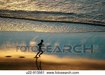 Jericoacoara (Ceara, Brazil): a man jogging at sunset along the beach View Large Photo Image Stock Image - Jericoacoara (Ceara, Brazil): a man jogging at sunset along the beach. Fotosearch