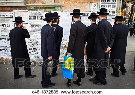 Stock Photography - Jerusalem, Israel, Yeshivah, Mea Shearim quarter, Orthodox Jews reading advertisements. Fotosearch