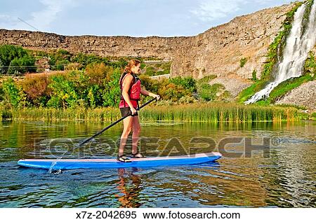 Jessica Florian riding the Standup Paddle Board at Thousand Springs in the Snake River Canyon near the city of Hagerman in southern Idaho. View Large Photo Image Stock Photography - Jessica Florian riding the Standup Paddle Board at Thousand Springs in the Snake River Canyon near the city of Hagerman in southern Idaho.. Fotosearch
