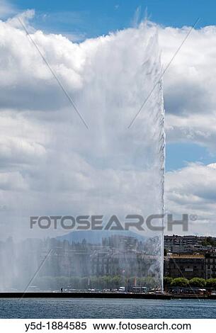 Jet d? Eau fountain on Geneva Lake in Geneva, Switzerland, one person under the fountain shows the size of it View Large Photo Image Stock Photography - Jet d? Eau fountain on Geneva Lake in Geneva, Switzerland, one person under the fountain shows the size of it. Fotosearch