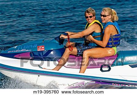 Stock Image - jet ski couple. Fotosearch