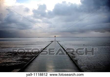 Jetty and storm clouds View Large Photo Image Stock Image - Jetty and storm clouds. Fotosearch