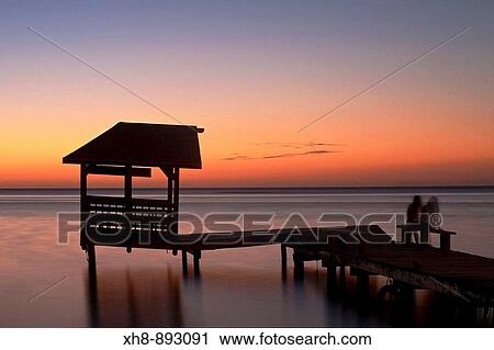 Stock Image - Jetty at sunset, West End, Roatan, Bay Islands, Honduras. Fotosearch