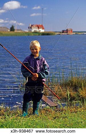 Stock Photo - jeune pecheur a Orissaare sur l? ile de Saaremaa, Estonie, pays balte, europe du nord. Fotosearch