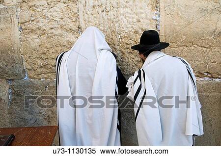Jewish men pray by the wailing ( western ) wall of the old temple in Jerusalem. View Large Photo Image Stock Photography - Jewish men pray by the wailing ( western ) wall of the old temple in Jerusalem.. Fotosearch