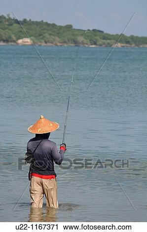 Jimbaran (Bali, Indonesia): a man fishing at the Jimbaran beach View Large Photo Image Stock Image - Jimbaran (Bali, Indonesia): a man fishing at the Jimbaran beach. Fotosearch
