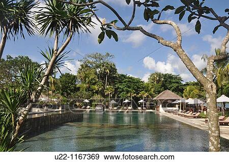 Jimbaran (Bali, Indonesia): the Jimbaran Puri Bali luxury resort's swimming pool View Large Photo Image Stock Photo - Jimbaran (Bali, Indonesia): the Jimbaran Puri Bali luxury resort's swimming pool. Fotosearch