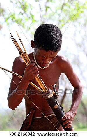 Jo/? hoansi San man putting his hunting gear together, Namibia, Africa. View Large Photo Image Stock Image - Jo/? hoansi San man putting his hunting gear together, Namibia, Africa.. Fotosearch