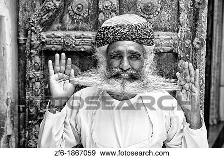 Jodhpur at Fort Mehrangarh in Rajasthan India a great image of bearded character man guard in doorway of Fort Palace in costume View Large Photo Image Stock Photo - Jodhpur at Fort Mehrangarh in Rajasthan India a great image of bearded character man guard in doorway of Fort Palace in costume. Fotosearch