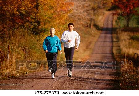Jogging on country road View Large Photo Image Stock Photo - Jogging on country road. Fotosearch